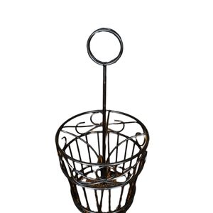 Black metal utensil holder.